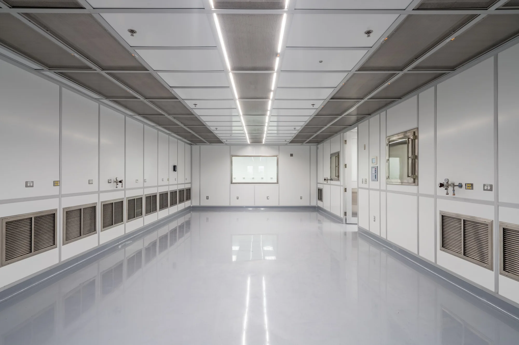 White corridor of the Building 31 clean room, built for the asteroid Bennu samples.